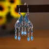 2026 Seus Brincos Simétricos Tixi Pavimentados com Diamante de Pavão, Brincos de Estilo Étnico Únicos, Joias Daisy Yiwu