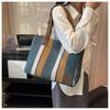 Atacado de fábrica nova bolsa feminina moda listrada contraste lona portátil bolsa de ombro grande capacidade casual bolsa mensageiro feminina