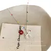 ¡¡¡Súper lindo!!! Collar Colgante Perro Globo M&M Rojo para Mujer, Nuevo Accesorio de Cadena para Suéter de Alta Gama Otoño e Invierno 2025