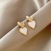 Pendientes elegantes y sencillos de perla con forma de corazón para mujer, diseño de nicho de lujo ligero, alta gama, Corea del Sur, pendientes y joyas para las orejas que combinan con todo.