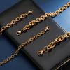 Pulseira Hiphop de Aço Inoxidável Dourada Cruz O-Chain Pulseira Moderna de Marca Hip-Hop Combina com Tudo Acessórios de Pulseira de Aço Titânio para Homens e Mulheres