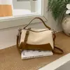 Bolsa de mão pequena de cor bloco com retalhos de nicho de alto valor para mulheres, nova para o verão de 2026, bolsa simples e estilosa de ombro único ou transversal