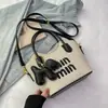 Bolsas de Mujer Transfronterizas 2026 Nueva Moda Tendencia Bolso Cubo de Paja con Letras Versátil Bolso de Hombro y Cruzado para la Playa