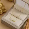 Chapado en oro real temperamento de alta calidad cadena para la clavícula diseño de nicho femenino sentido del diseño collar de corazón de melocotón collar de moda coreana joyería
