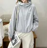 Chaqueta de trabajo con capucha para estudiante de mujer, primavera y otoño 2026, chaqueta deportiva popular de moda de corte holgado