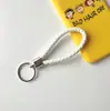 Llavero creativo llavero de cuerda de cuero cordón para llaves colgante de joyería cordón tejido fábrica de cuerda de cuero venta al por mayor
