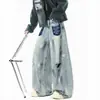 Jeans exclusivo com design graffiti desgastado para homens e mulheres, calças largas retrô de outono, calças casuais cool de alta qualidade.