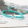 Pulsera tejida de nudo plano de trébol de cuatro hojas de venta caliente transfronteriza para parejas y estudiantes, tendencia europea y americana inspirada en la dopamina, joyería al por mayor de fabricante