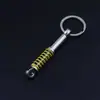 Llavero de Modificación de Coche Transfronterizo Amortiguador Pequeño Regalo Llavero de Metal Casco Semáforo Rotor Mayoreo