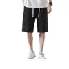 Shorts básicos casuales de color liso para hombre al por mayor, ajuste recto holgado, pantalones deportivos versátiles, pantalones de chándal ligeros, shorts hasta la rodilla