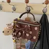 Bolso pequeño súper popular para el trabajo, nuevo bolso de cubo con cadena para hombro cruzado de gamuza para mujer, otoño 2026