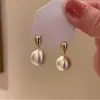 Pendientes de bola de metal cepillado esmerilado de temperamento nicho 2024 nuevos populares otoño e invierno pendientes de lujo ligero