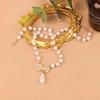 Collar de perlas, ligero, de lujo, elegante, a la moda, con lazo, diseño que combina con todo, estilo frío, cadena de lana A006