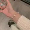 Pulseira de pérolas Camélia design de nicho ins para meninas namoradas joias simples de luxo leve temperamento gentil atacado