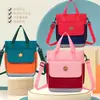 Bolso para estudiante de primaria nuevo clase de entrenamiento bolsa de trabajo portátil doble espalda bandolera tres usos mochila infantil logo personalizado