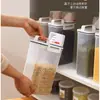 Cubo de arroz sellado portátil de plástico estilo japonés con taza medidora, caja de almacenamiento de arroz a prueba de humedad y a prueba de insectos, tanque de almacenamiento de granos y fideos para cocina