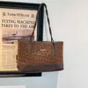 Bestseller transfronterizo bolso de mujer con estampado de leopardo, bolso de hombro y axila de gran capacidad, nuevo modelo 2026, alto valor estético, bolso tote moderno y versátil