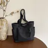 Bolso de lona de moda para mujer 2026 nuevo modelo de gran capacidad, bolso tote simple para estudiantes universitarios, bolso de mano para ir a clase, bolso de hombro