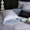 Nuevo juego de ropa de cama de cuatro piezas de algodón de fibra larga cepillado, con 60 hilos, que ofrece una sensación lujosa y de alta gama, disponible en estilos de sábana plana, sábana ajustable y colcha de algodón puro