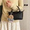 Bolso cruzado tejido de diseño de nicho nuevo 2026, bolso de mano versátil casual para mujer, estilo albóndiga