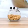 Venta al por mayor de fábrica Botella Transparente de Tambor Plano para el Hogar Sellada a Prueba de Humedad Tarro de Almacenamiento para Cereales y Frutas Secas Tarro de Almacenamiento de Vidrio Embotellado