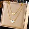 Elegante collar de corazón de doble capa, cadena de acero inoxidable chapada en oro de moda de nicho transfronterizo, cadena para la clavícula de lujo ligero para mujer