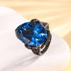 Anillo de lujo Zhuangshengsheng de cobre chapado en oro con forma de huevo de corindón de imitación, ligero y de oro negro, para mujer, 15 x 20