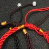 Algodón de fibra cuerda roja elástica fabricantes al por mayor pulsera tejida con cuentas de cola estilo nacional alambre joyería deshilachada