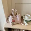 Bolsa Tote Nova Estilo Coreano de Nicho para Mulheres Primavera 2026, Bolsa de Ombro Cruzada Única, Bolsa de Mão de Moda Exquisita de Alto Padrão, Versátil