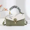 Bolsa Cuadrada Pequeña con Bordado de Flor Minimalista para Mujer 2026 Nueva Versátil Hebilla Bolso Cruzado Textura de Lujo Ligero Bolso de Mujer Transfronterizo