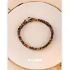 Collar Estilo Maillard Ojo de Tigre Lujo Accesible Moda Retro Gama Alta Cadena para Suéter con Cuentas Nuevo Otoño e Invierno 2025