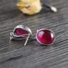Pendientes de plata S925 con personalidad para mujer, joyería de moda, con hebilla de corindón rojo liso, productos de fábrica de nueva fuente