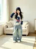 Conjunto de dos piezas de nuevo estilo para niña Otoño 2026: Conjunto de Sudadera Falsa de Dos Piezas y Jeans de Pierna Ancha para Niñas Mayores, Conjunto de Dos Piezas de Dibujos Animados y Moderno