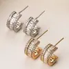 Corea del Sur lujo ligero elegante de moda semicírculo micro incrustación de circón Super flash aretes versátiles aretes de alta calidad que no se decoloran