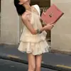 Vestido beige de encaje sin mangas con cuello halter, espalda descubierta, suelto para mujer, nuevo vestido corto de línea A para otoño 2026 con tiras de amarre