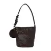 Bolso cubo tejido de nicho casual estilo coreano para mujer, nuevo bolso de hombro de moda, bolso de hombro y cruzado para commuting