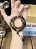 2026 Nuevo Estilo Chino Apilable Doble Círculo Cristalino Rima Ojo de Tigre Pulsera Estilo Étnico Sensación de Alta Gama Regalo para Novia Regalo de San Valentín