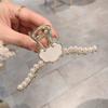 Pinza Tiburón Perla Grande Parte Trasera Disco Pinza para el Cabello Sentido Avanzado Flor Pedrería Ojo de Gato 2022 Nueva Pinza de Agarre