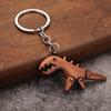 Llavero de metal creativo con forma de dinosaurio, joyería, llavero de dinosaurio pequeño de ciencia ficción jurásica, adornos para mochila escolar de estudiante