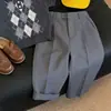 Traje casual de punto para niño, nuevo de verano 2026, con polo a cuadros grises de manga corta y pantalón largo