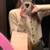 Cardigan Tricotado Branco Suave Gola V Estilo Francês 2026 Outono e Inverno Novo Estilo Estilo Preguiçoso Jaqueta Suéter Curta que Marca a Cintura