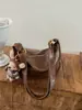Bolso de mano minimalista estilo coreano, diseño nuevo, material de alta calidad, bolso de hombro o bolso cruzado elegante y versátil