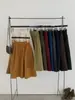 26 Nova coleção de outono: Saia midi plissada, de cor sólida, cintura alta e elástica, versátil, linha A, para trabalho e uso casual