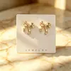 Pendientes de lazo dorado transfronterizos europeos y americanos, elegantes y modernos, con un diseño de alta gama y único, hechos de metal