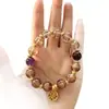 Pulsera de cristal con lámina de oro, multi-tesoro, Buda de jade, de diseño cultural y artístico, para mujer, de lujo ligero con sensación de alta gama, que atrae la fortuna y la suerte, con diseño estilo chino