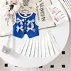 Conjunto de Verano para Niños Europeos y Americanos Nuevo con Parche de Lazo Chaleco sin Mangas Falda Plisada Color Sólido Estilo Escolar Fabricante