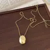 Colar Pingente Metálico Oval de Aço Titânio Nicho Personalizado Moda Corrente de Lã Ajustável Colar Versátil de Alta Qualidade para Mulheres