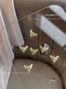 Nuevo Aleación de Arco Joyería para Uñas Líquidas Luz Destellante Diamante de Lujo Luna Mariposa Decoración de Uñas Taladro Al por Mayor