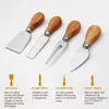 En stock tabla de quesos de bambú tabla de cortar quesos juego de cuchillos cuatro en uno tabla de cortar para cocina doméstica estilo transfronterizo de Amazon