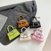 Bolsa Mini de Mão Texturizada Estilo Coreano 2025 Menina Laço Corrente Batom Fone de Ouvido Transversal Moderna